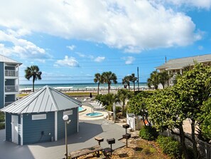 Sun-drenched Gulf view from balcony