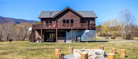 Large purpose-built vacation cabin on the river with a huge yard