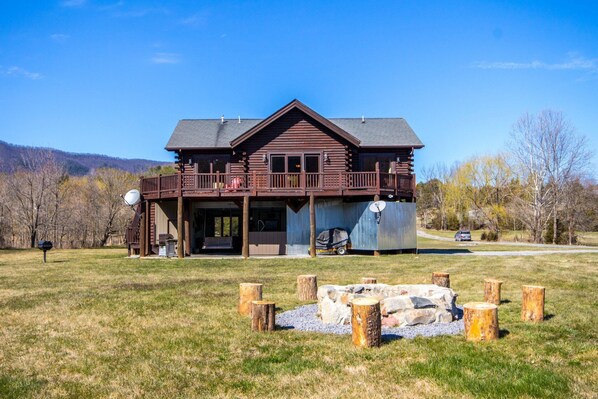 Large purpose-built vacation cabin on the river with a huge yard