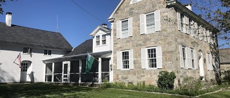 Stone front, attached living space barn