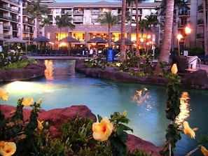 Twilight view lava pool - hotel lobby/restaurant in background