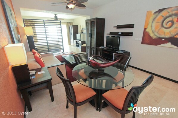 View from kitchenette into living room and bed area.