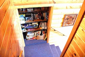 Board Games, books and puzzles in stairwell nook