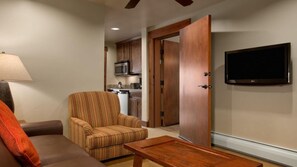 Suite sitting area looking into galley kitchen