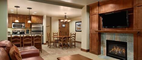 Main living room with gas fireplace and flat screen.  Full kitchen and dining.