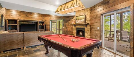 Full sized pool table in the lower level family/game room