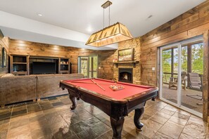 Full sized pool table in the lower level family/game room