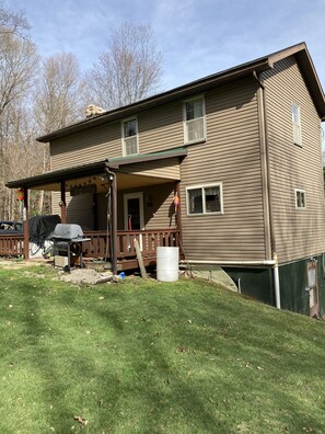 Back of camp looking towards open one acre yard with fire pit.