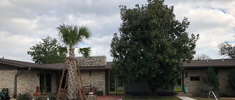 Our kidney-shaped pool has a midcentury retro vibe and a diving board too!