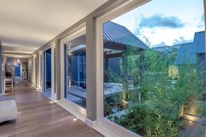 Interior passage connecting living areas to bedroom suites