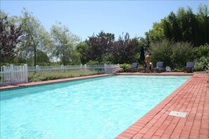 Heated, gunite pool surrounded by mature plantings and total privacy