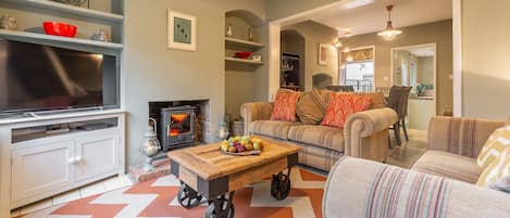 Ground floor: Cosy open-plan living area with a wood burning stove