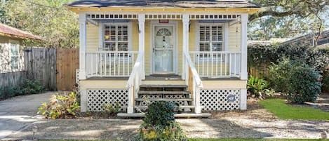 Shotgun cottage with inviting front porch to enjoy cool Gulf breezes