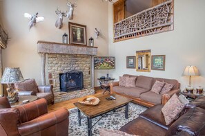 HDTV and Stone Fireplace with Gas Logs in the Living Room