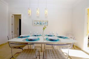 Modern dining area for six guests on a side of the lounge