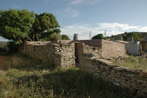 Side view of the hut, a time forgotten walking path starts from here