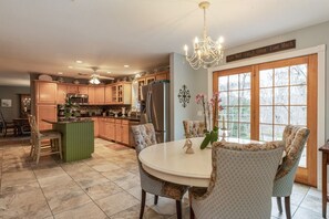 Kitchen table is round but oval when extension leaf is added.
