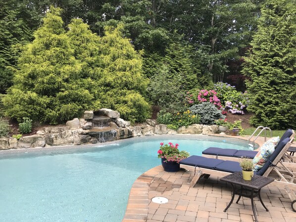 Chaise lounges facing the relaxing Waterfall and Gardens
