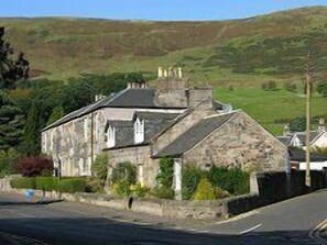 Harviestoun House with Ochil Hills in background