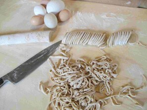 Learn how to make fresh pasta by hand, with our chickens' eggs.