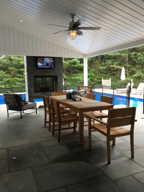 Patio with tv and fireplace