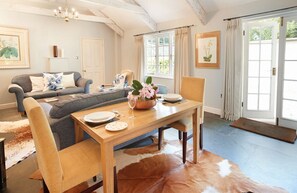 Ground floor: Open plan sitting room with wood burning stove and dining area