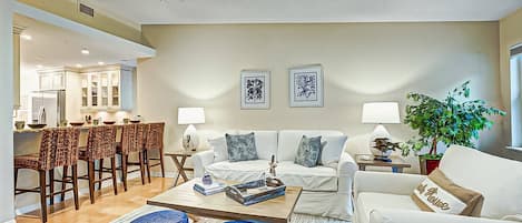 Living room is open, light and bright.  Enjoy breakfast at the breakfast bar or out on the lanai....