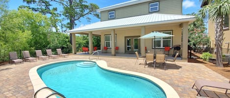 Back of Destin Sun with a Wrap Around Style Covered Back Porch! Lots of Seating! Large Private Saltwater Pool! Lounge Chairs! 2 Outdoor Dining Areas! Grill! A Backyard for the Whole Family to Enjoy!