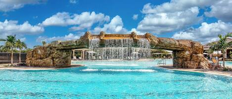 This waterfall resort pool gives vacation VIBES!