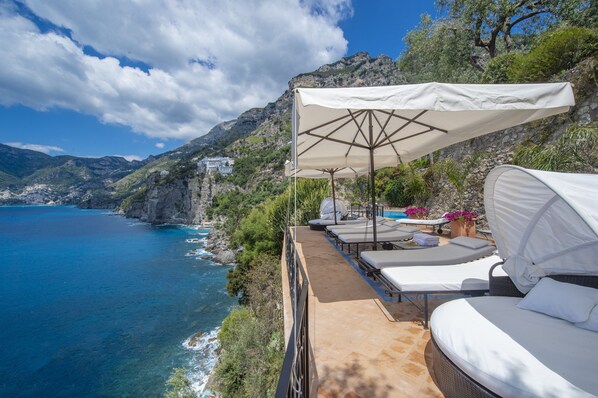 Luxury sun bathing area, with large heated pool