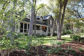 Large front and back yards with many trees and beautiful landscaping