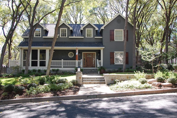 View of our home from the street.  Screened porch located on left side of home.