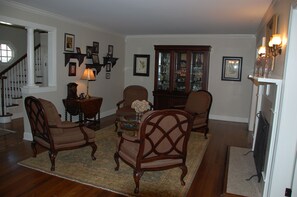 formal living area with fireplace (right side of photo)