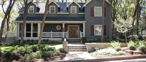 View from street.  Screened porch located on left side of home