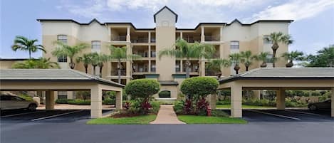 Building entrance.  Golf course behind.  