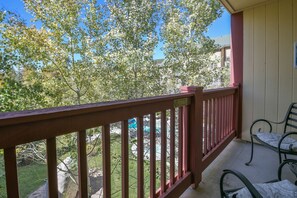 Upper level balcony with pool courtyard view