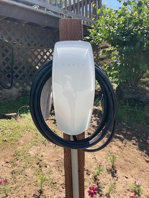 Tesla charging unit solely for the use of my guests. Adapter for other EVs. 