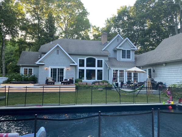 Backyard with heated pool,  hot tub and removable child safety fence 