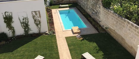 Garden and pool view from a terrace