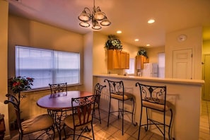 Kitchen island offers extra seating for dining.