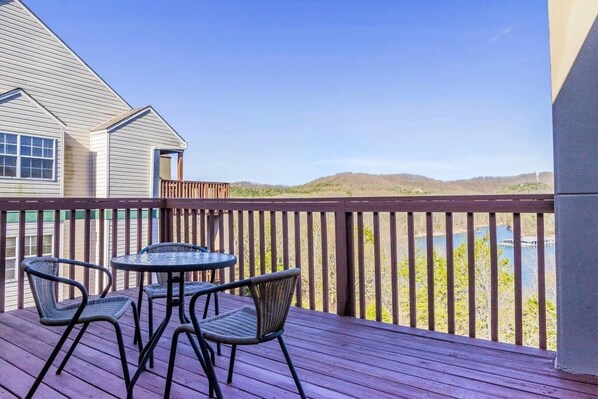 Private balcony overlooks the hills and lake.