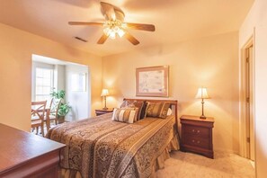 Master bedroom has a queen-size bed.