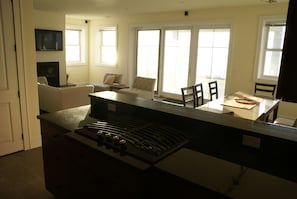 Looking from kitchen to living and dining