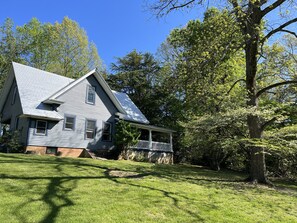 Front yard and wrap around porch on right.