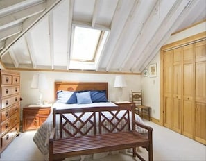 The upstairs master bedroom suite spans the entire footprint of the main house.