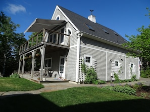 Motorized awning provides morning shade.
