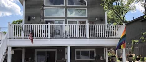 View of the house from the lake.  Upper deck and lower patio.