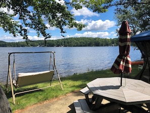 Charcoal and gas grills. Large picnic table.  In season, screened canopy.