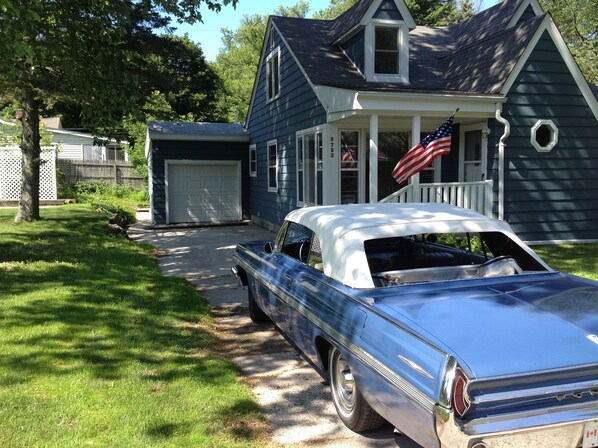 Front of house, driveway and part of side yard. (Classic car not included)