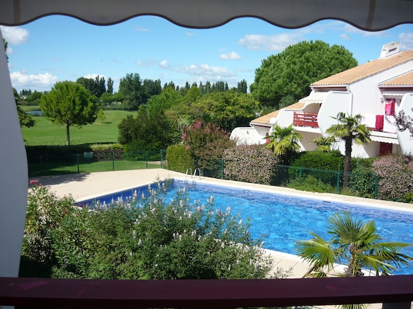 view from the terrace on the golf court and the swimming pool